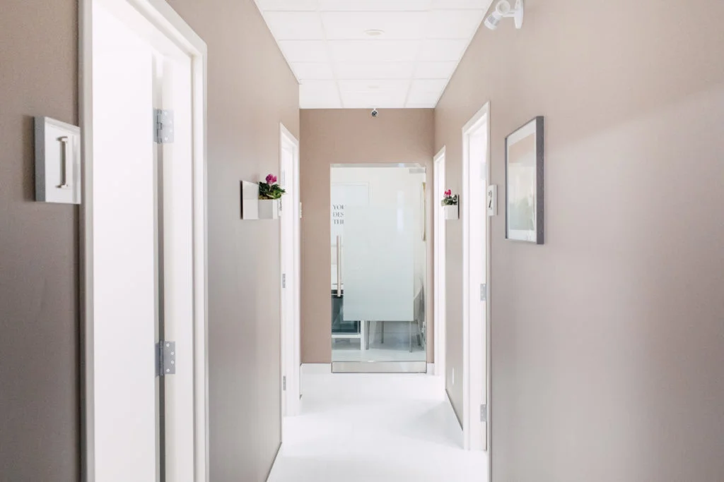 a hallway with white doors